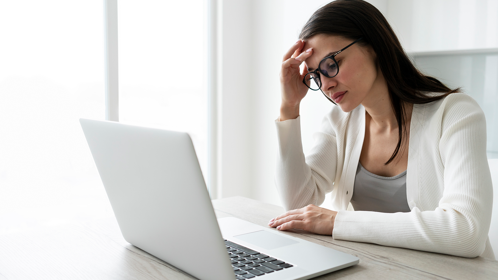 medium-shot-tired-woman-working-with-laptop