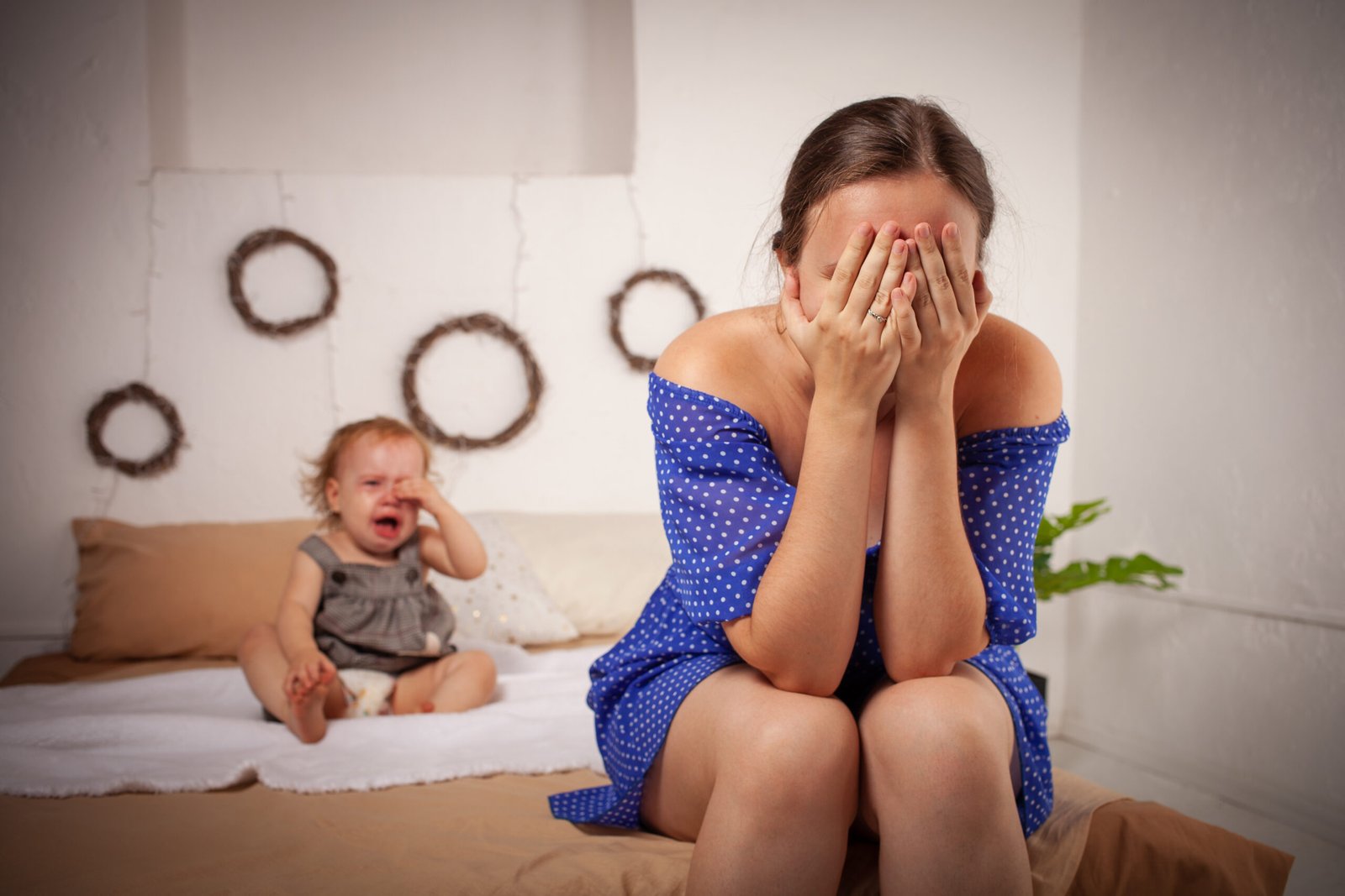 Mom is tired of the baby, wants to rest and sleep. The child screams, hysterical. The woman is tired of the child's cry, she does not want to hear it. A one-year-old girl yells from a toothache.
